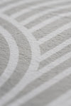 Close-up image highlighting a white and grey pattern, emphasizing its delicate design and visual depth.