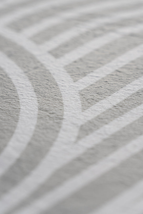 Close-up image highlighting a white and grey pattern, emphasizing its delicate design and visual depth.