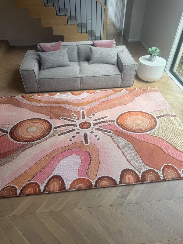 A decorative rug placed on the floor of a cozy living room, enhancing ...