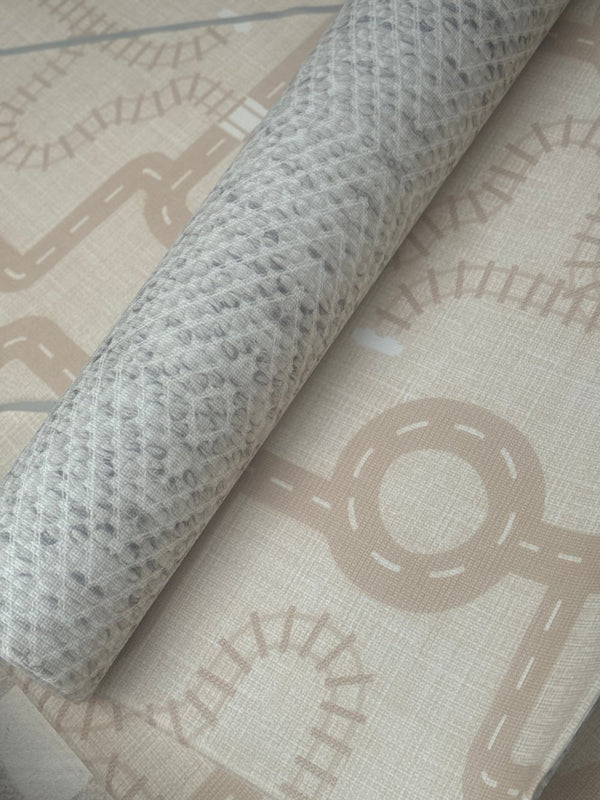 A roll of fabric printed with a detailed map design, showcasing various geographical features and landmarks.