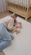 A mom is playing with his baby