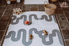 Wooden toys on Baby Driver Boho playmat. Side B has a car track design.