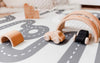 Wooden toys on Baby Driver Earl Round playmat. Side B has a car track design.