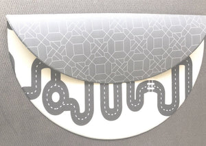 Two sides of Baby Driver Earl Round playmat. Side A has a grey geometric pattern and side B has a car track design.